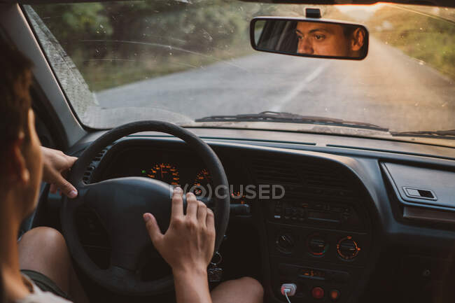 Anonymous guy driving modern vehicle along asphalt road in amazing countryside in Bulgaria, Balkans — Stock Photo