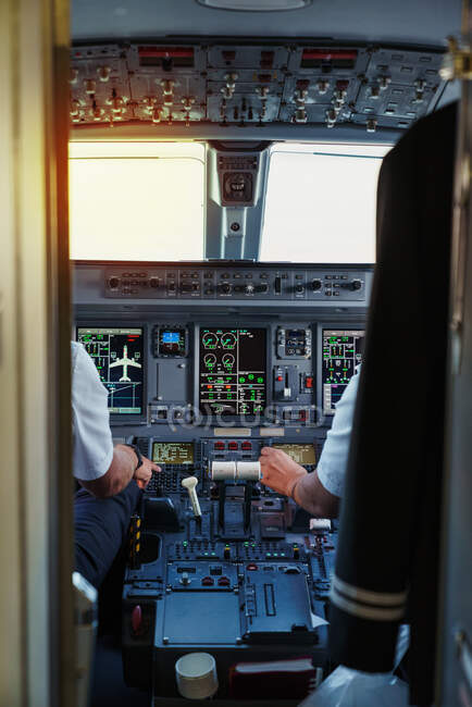 Dashboard of cockpit with pilots — Stock Photo