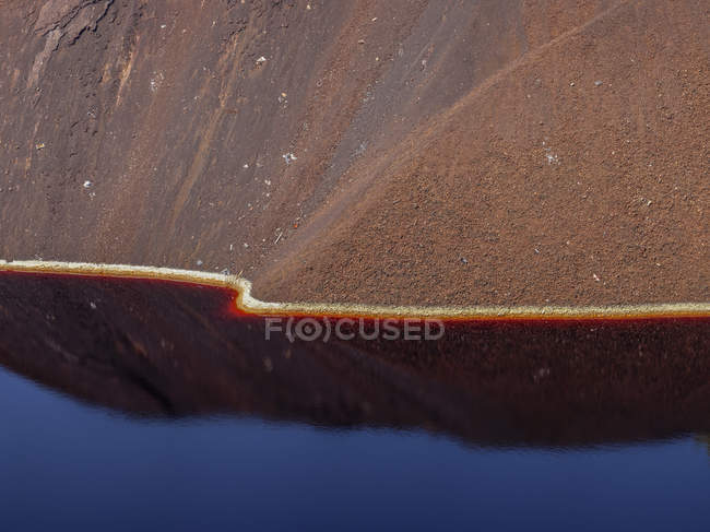 Calm surface of water near slope of quarry in Santo Domingos Mine, Portugal — Stock Photo