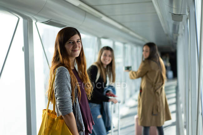 Young women walking in passage — Stock Photo