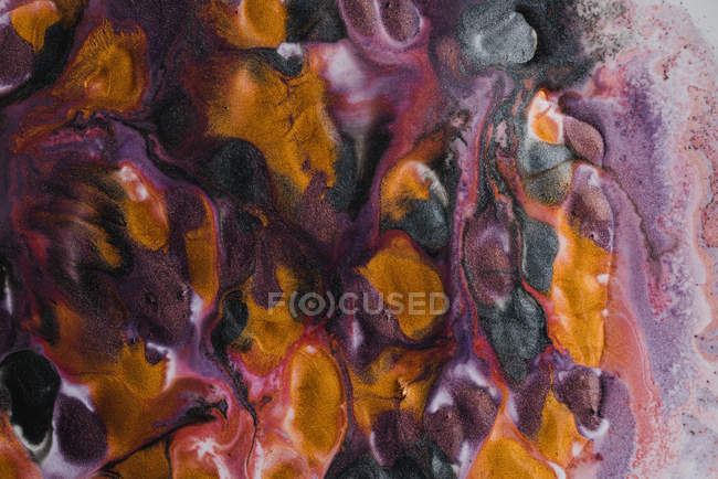Sfondo astratto di vivide fuoriuscite di sorprendente pigmento metallico — Foto stock