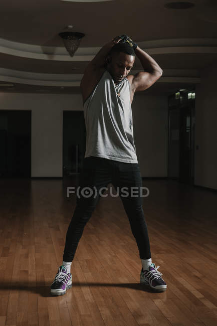 African American man warming up in gym — Stock Photo
