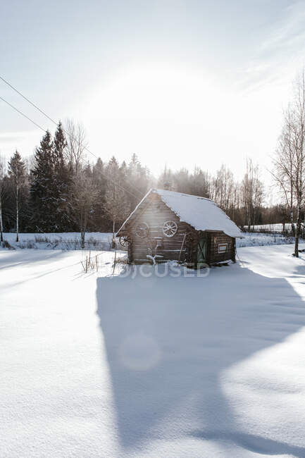 Old house between snow field — Stock Photo