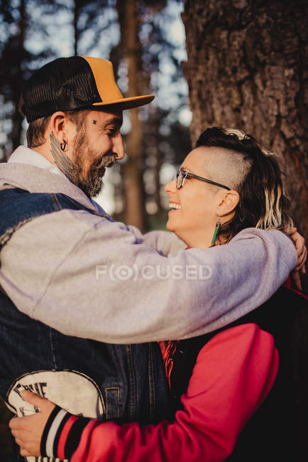 Happy couple looking at each other on sunny weather — Stock Photo