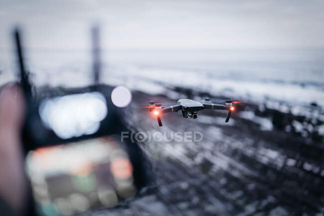 Drone flying near sea — Stock Photo