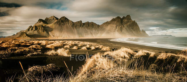 Panorama of grand cliff above water — Stock Photo