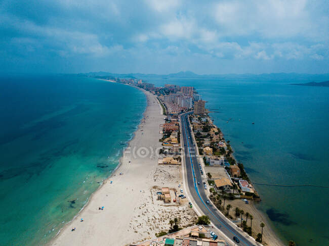Aerial drone view to town buildings and sea shore at turquoise lagoon — Stock Photo