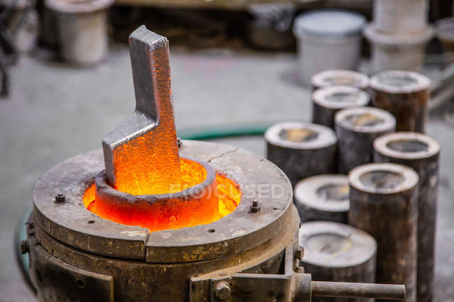 Metal ware melting in crucible — Stock Photo