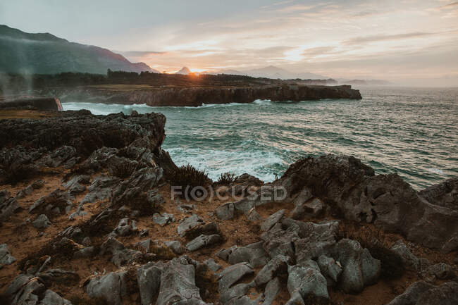 Top of stone near stormy sea in Bufones de Pria, Asturias, Spain - foto de stock
