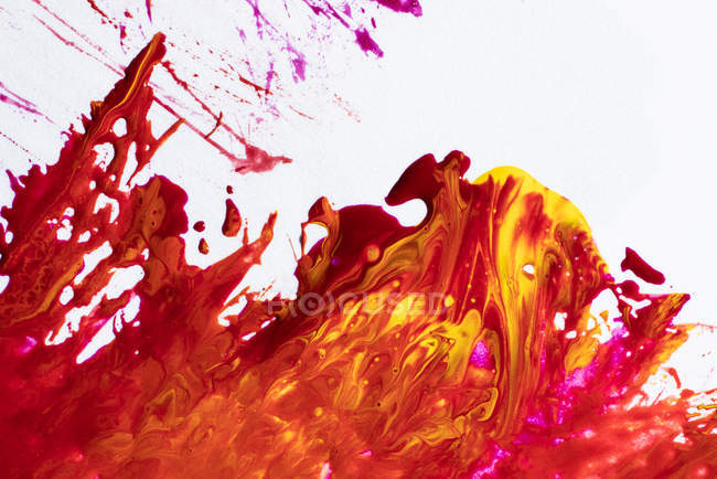 Abstraction of liquid paints in slow blending flow mixing together — Stock Photo