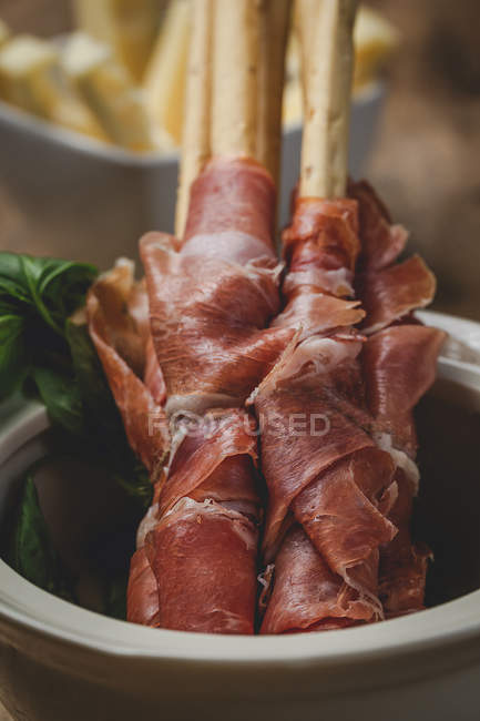Gressinis with spanish typical serrano ham in pot — Stock Photo