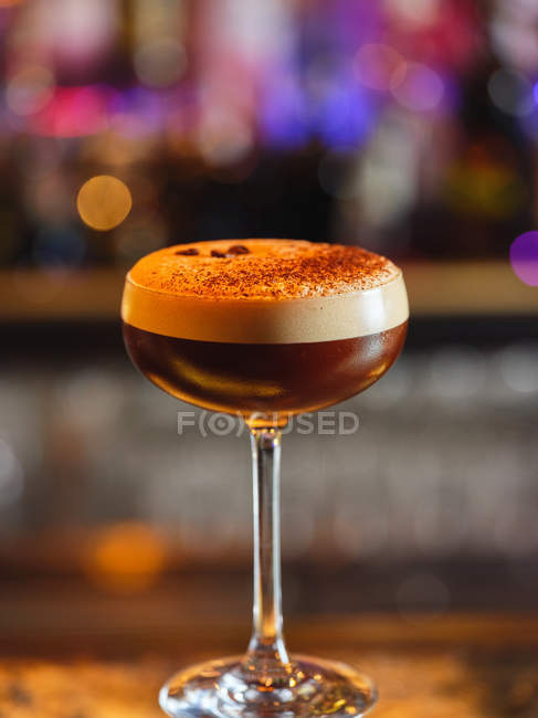 Glass with chocolate alcohol cocktail on blurred background — Stock Photo