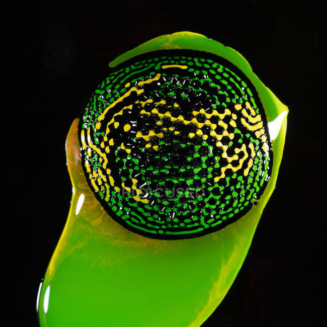 From above glob of amazing neon ferrofluid on black background — Stock Photo