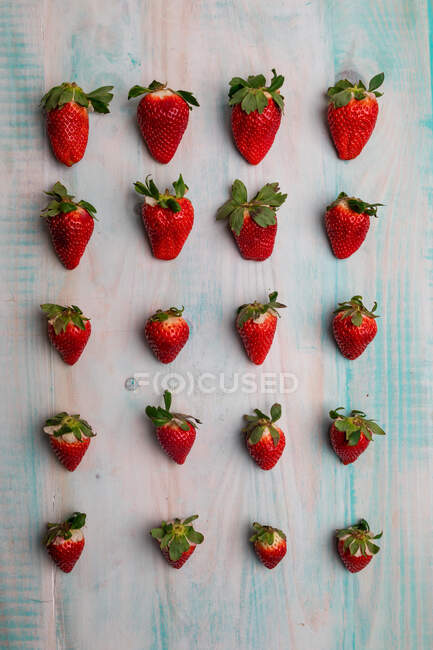 From above set of fresh red tasty strawberries on wooden background — Stock Photo