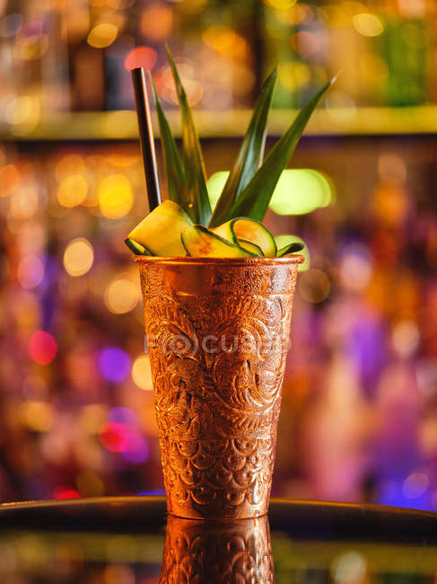 Metal cup with fruit cocktail — Stock Photo