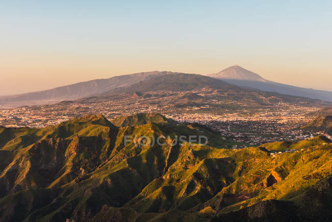 Picturesque view of village in valley near mountain Teide and blue sky in Tenerife, Canary Islands, Spain — Stock Photo
