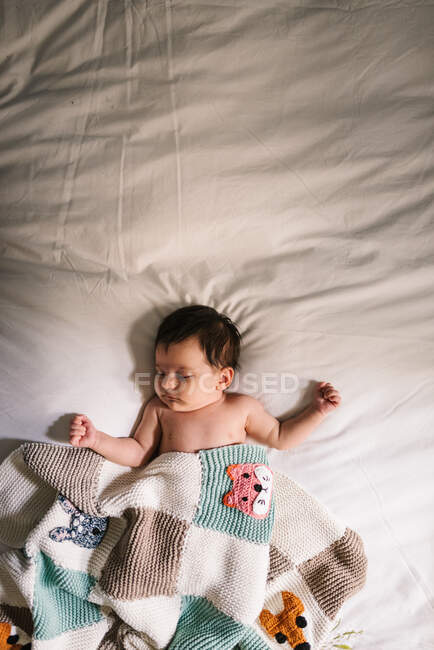 Cute baby sleeping on bed — Stock Photo
