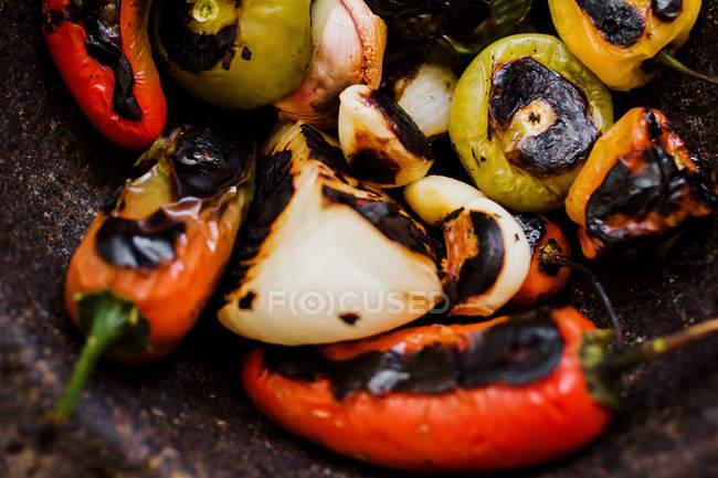 Close-up of delicious roasted vegetables in mortar — Stock Photo