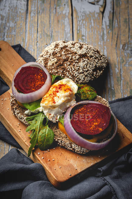Healthy homemade vegetable sandwich on wooden board — Stock Photo