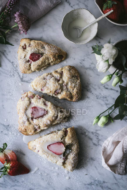Strawberry scones on marble table — Stock Photo
