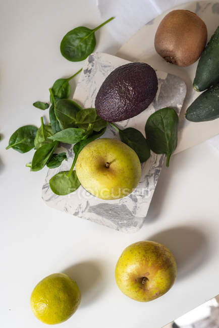 Fresh ingredients for green smoothie on white background — Stock Photo