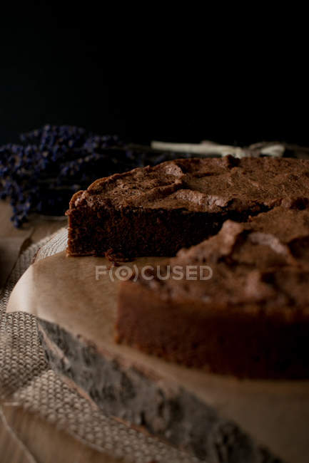 Beautiful delectable gluten free chocolate cake in timber tabletop in kitchen. — Stock Photo