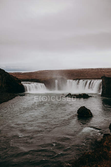 Waterfall in majestic countryside — Stock Photo