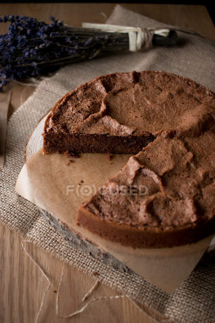 Beautiful delectable gluten free chocolate cake in timber tabletop in kitchen. — Stock Photo