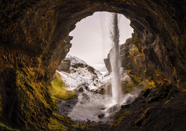 View from cave of Kvernufoss waterfall in Iceland — Stock Photo