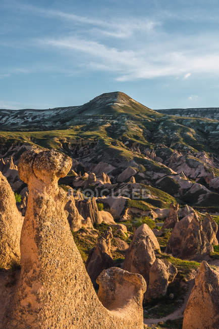 Stone formations in valley on sunny day in Cappadocia, Turkey — Stock Photo