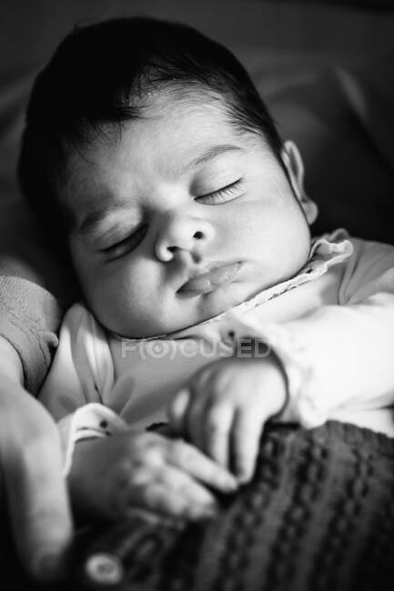 Father hugging cute little baby sleeping at home — Stock Photo