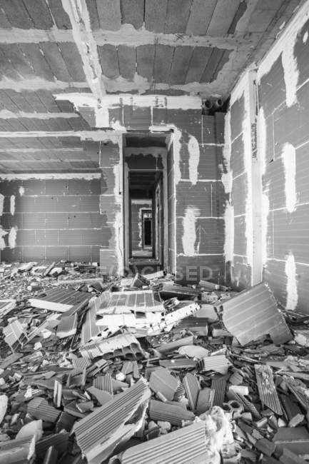 Heap of broken panels placed in building under construction — Stock Photo