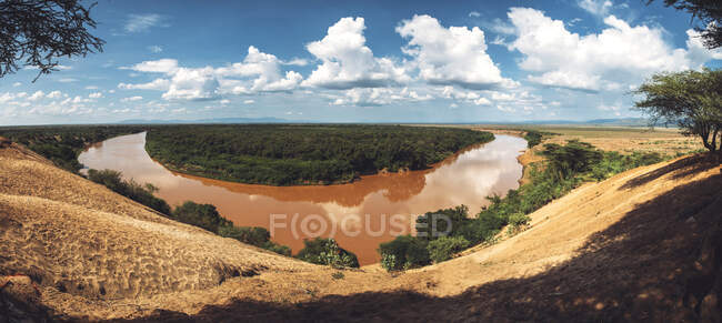 Amazing panoramic view of dirty Omo river on sunny day in Ethiopian countryside — Stock Photo