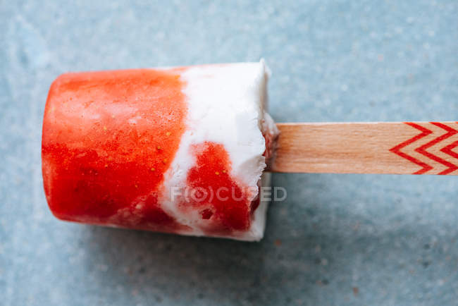 Closeup of watermelon and cream popsicle on grey background — Stock Photo