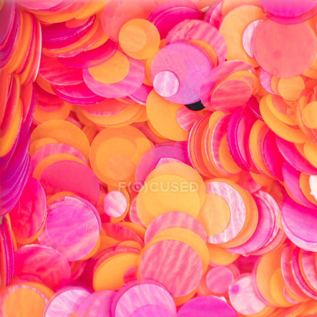 Fondo de lentejuelas purpurina y naranja - foto de stock