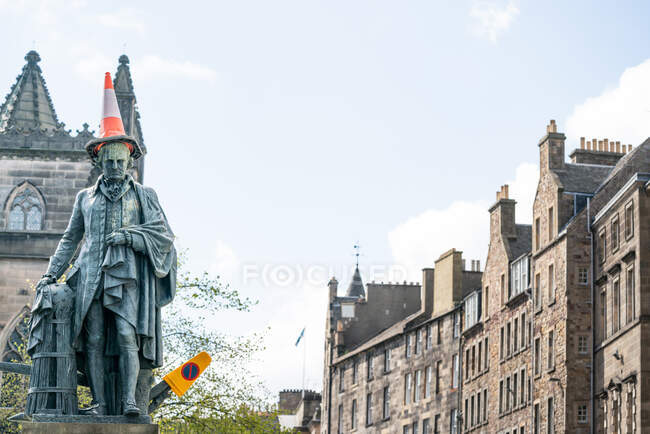 From below of sculpture of man with traffic road cone placed on head, Scotland — Stock Photo