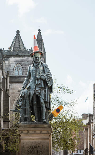 From below of sculpture of man with traffic road cone placed on head, Scotland — Stock Photo