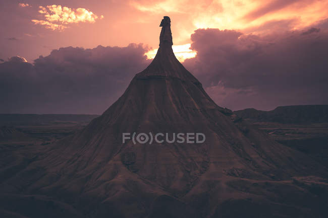 View of stone peak in desert against evening sky — Stock Photo