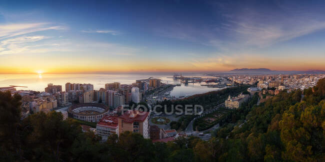 Beautiful panorama from air of cityscape with modern buildings in sunset light. — Stock Photo