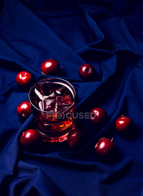 Red drink near fresh fruits — Stock Photo