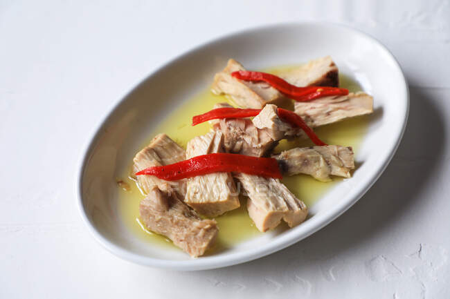 Delicious marinated tuna on white dish — Stock Photo