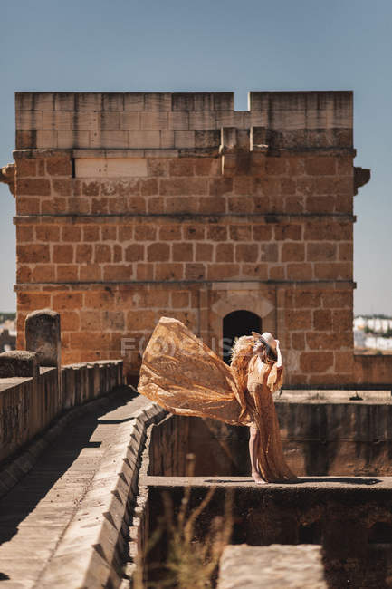 Stylish woman on old bridge — Stock Photo