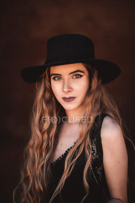 Elegant woman in ancient fortress — Stock Photo