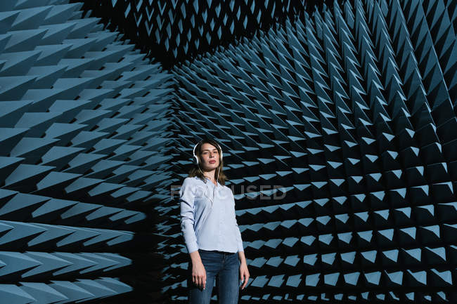 Woman in sound room listening to music — Stock Photo