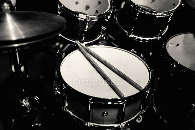 Drum set on stage in blue neon spotlights — Stock Photo