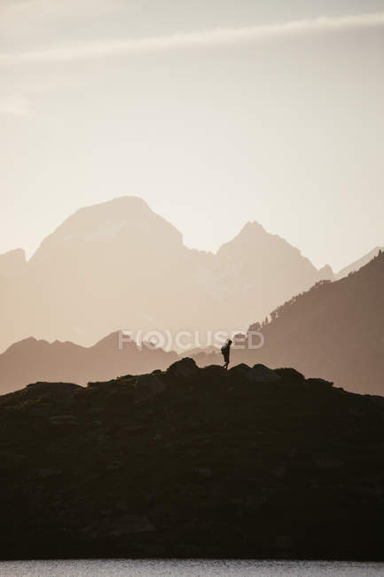 Majestic mountain landscape with human silhouette — Stock Photo