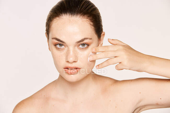 Amiable female taking care of face — Stock Photo