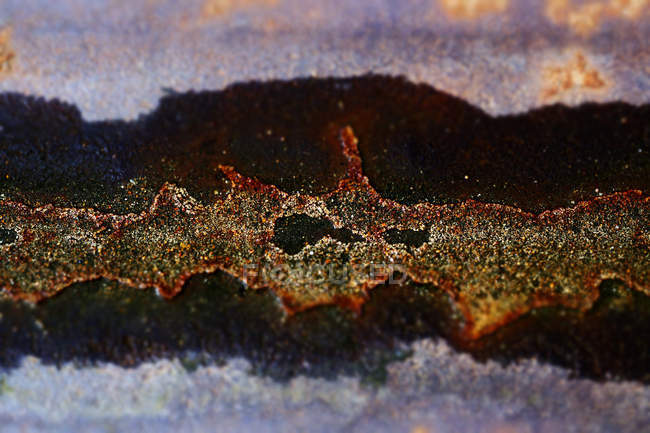 Closeup of painted rusty iron surface with corrosion spots and dirt — Stock Photo