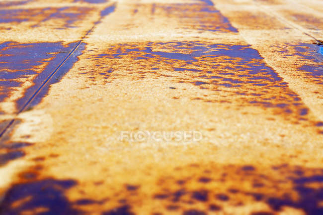 Closeup of rusty iron surface with corrosion spots and traces of old paint — Stock Photo