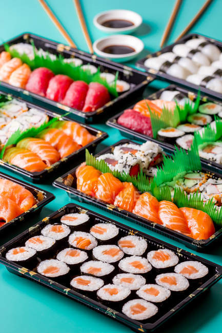 Appetizing delicious set of colorful sushi served on table in restaurant. — Stock Photo